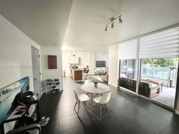 a living room with furniture and a large window