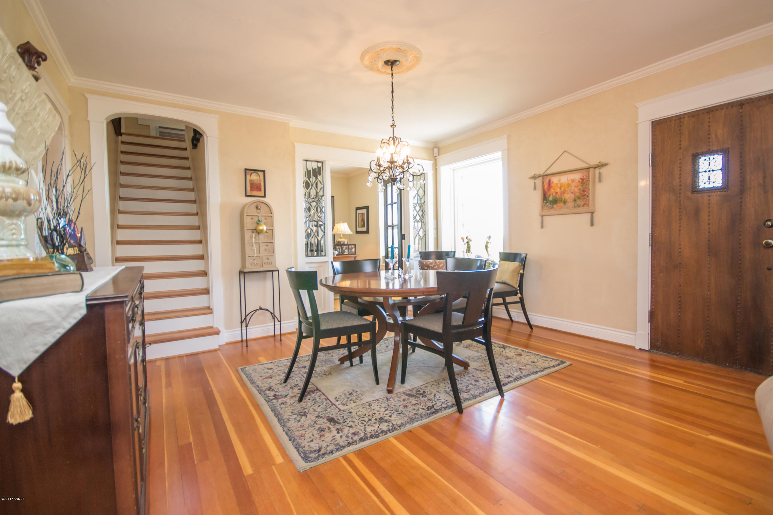 411 North Wickersham Road Yakima, WA 98908 - Photo 14 of 49 a view of a dining room with furniture window and wooden floor