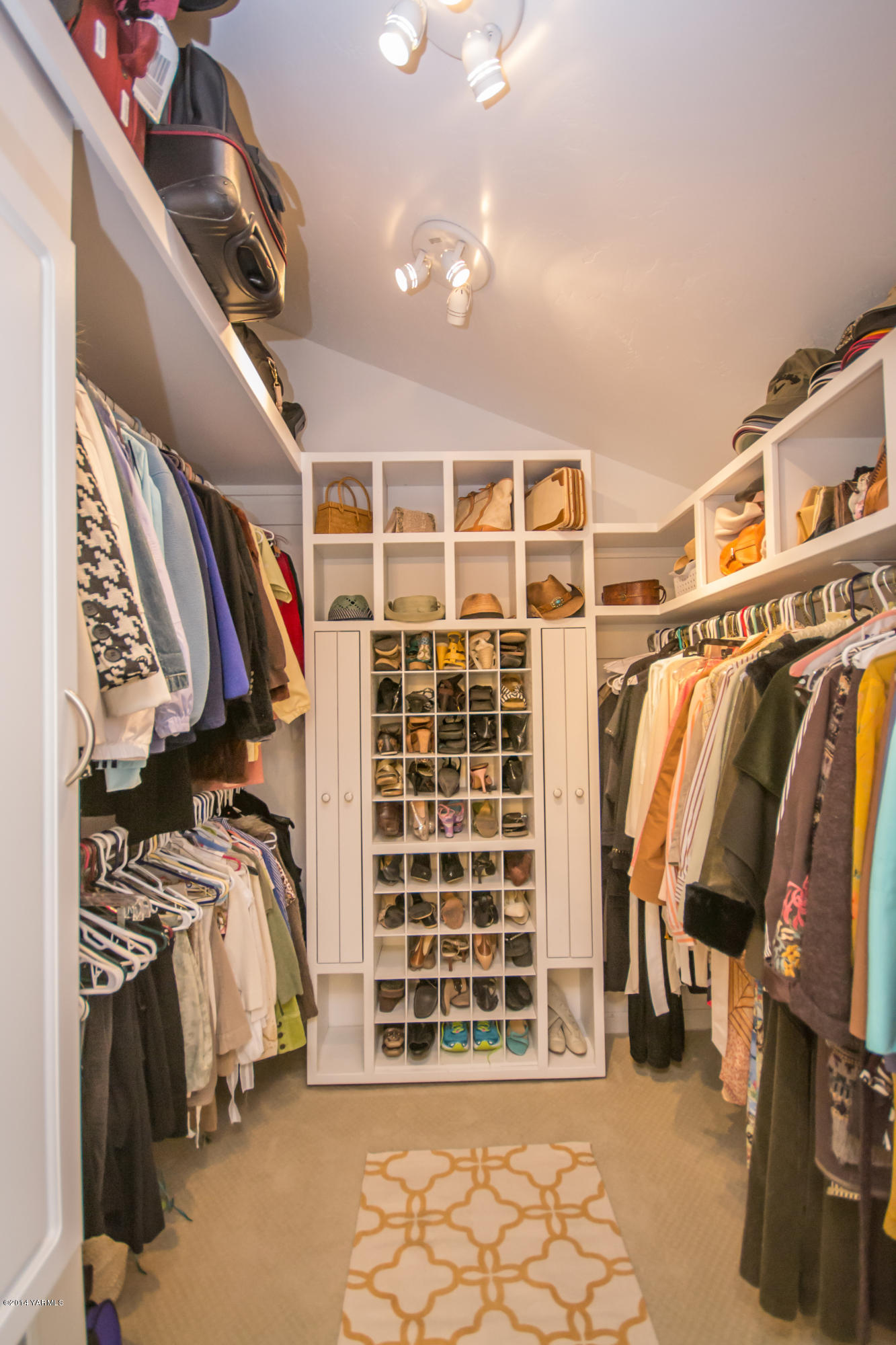 411 North Wickersham Road Yakima, WA 98908 - Photo 22 of 49 a view of walk in closet with clothes and shoes