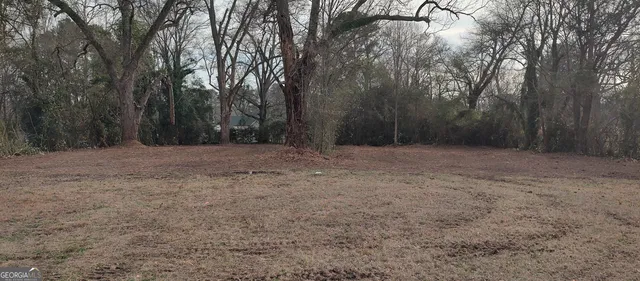 a view of empty room with trees