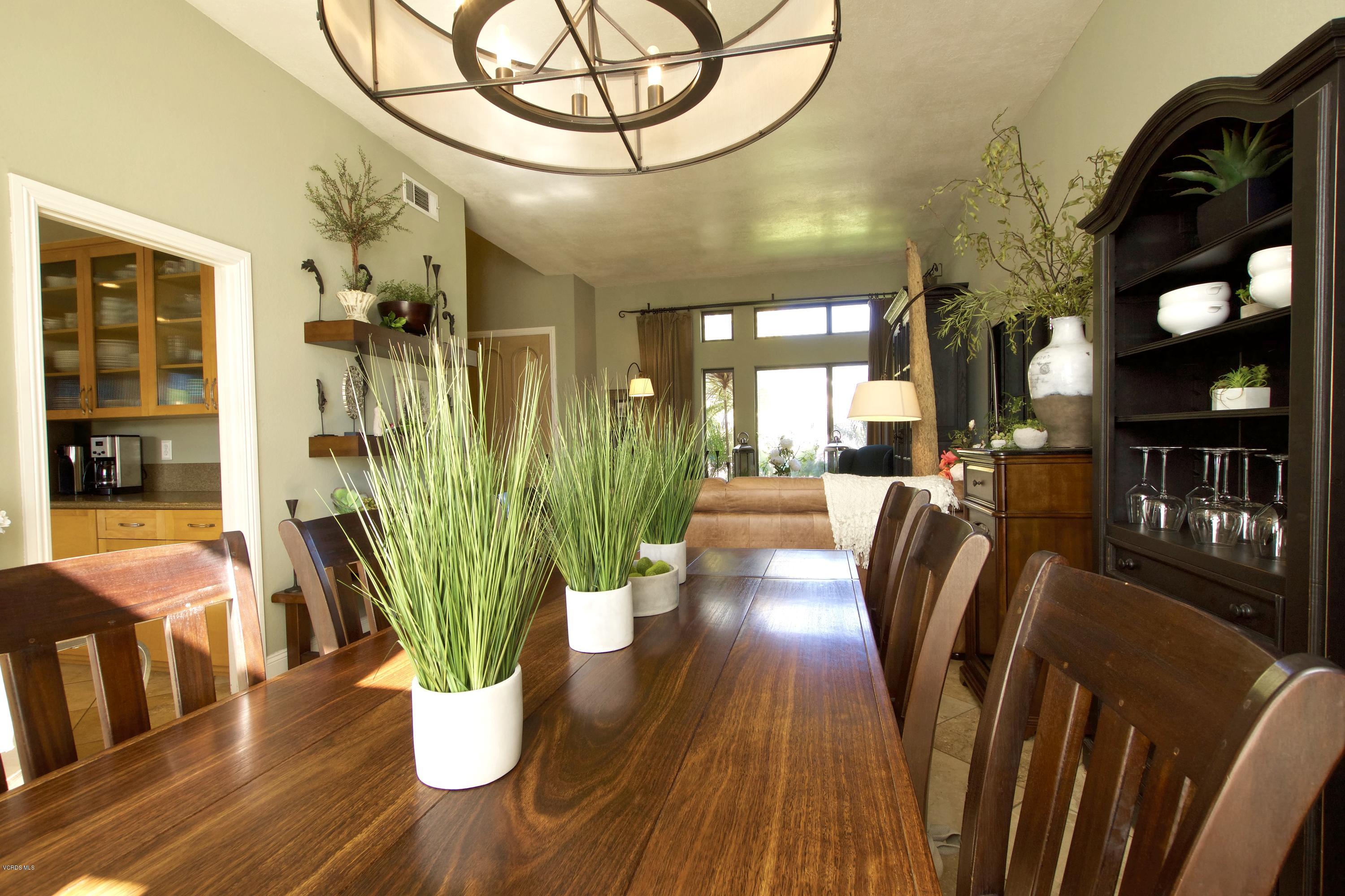 1133 Old Ranch Road Camarillo, CA 93012 - Photo 14 of 37 a view of a dining room with furniture a chandelier and wooden floor