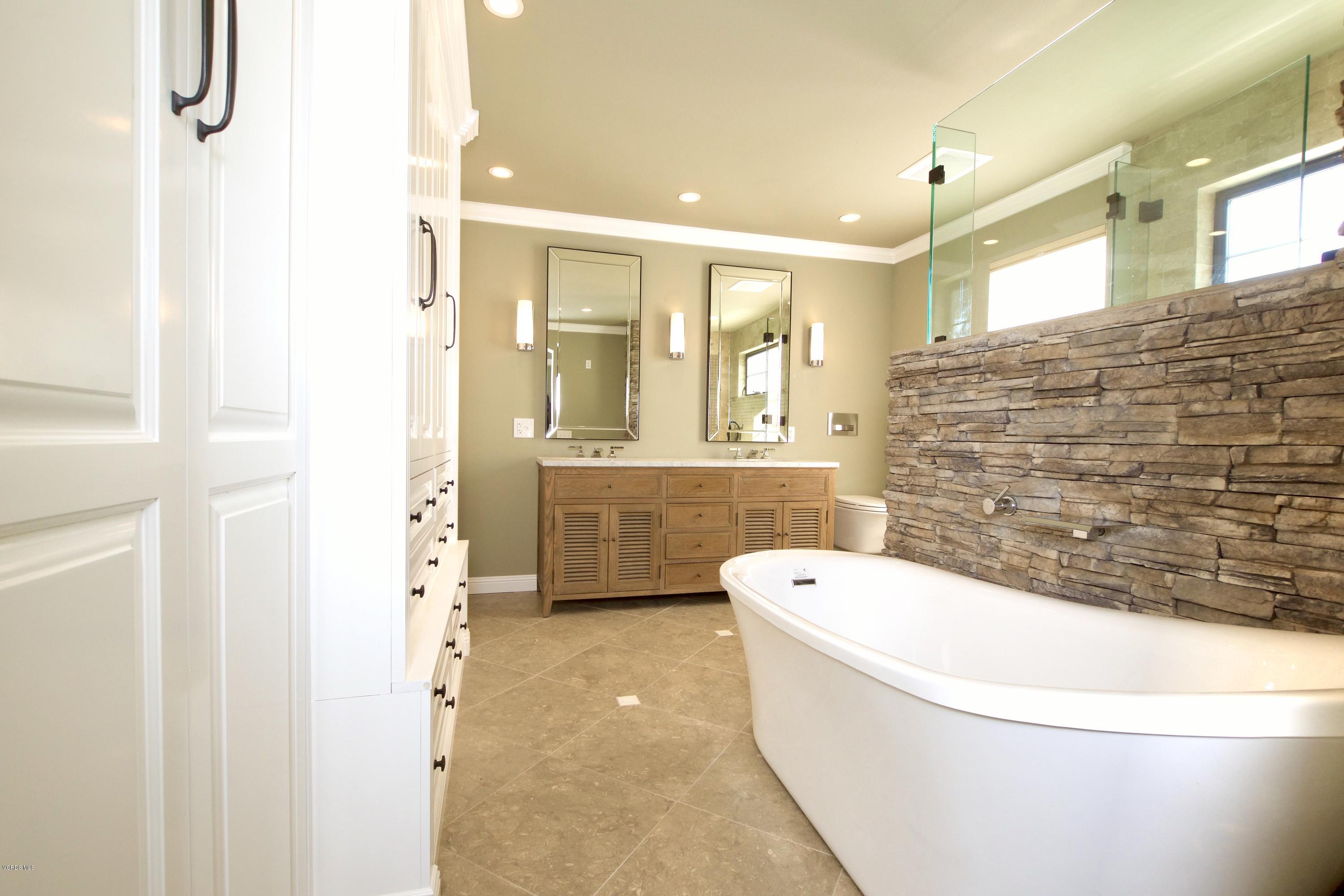 1133 Old Ranch Road Camarillo, CA 93012 - Photo 22 of 37 a bathroom with a toilet a sink a mirror and bathtub