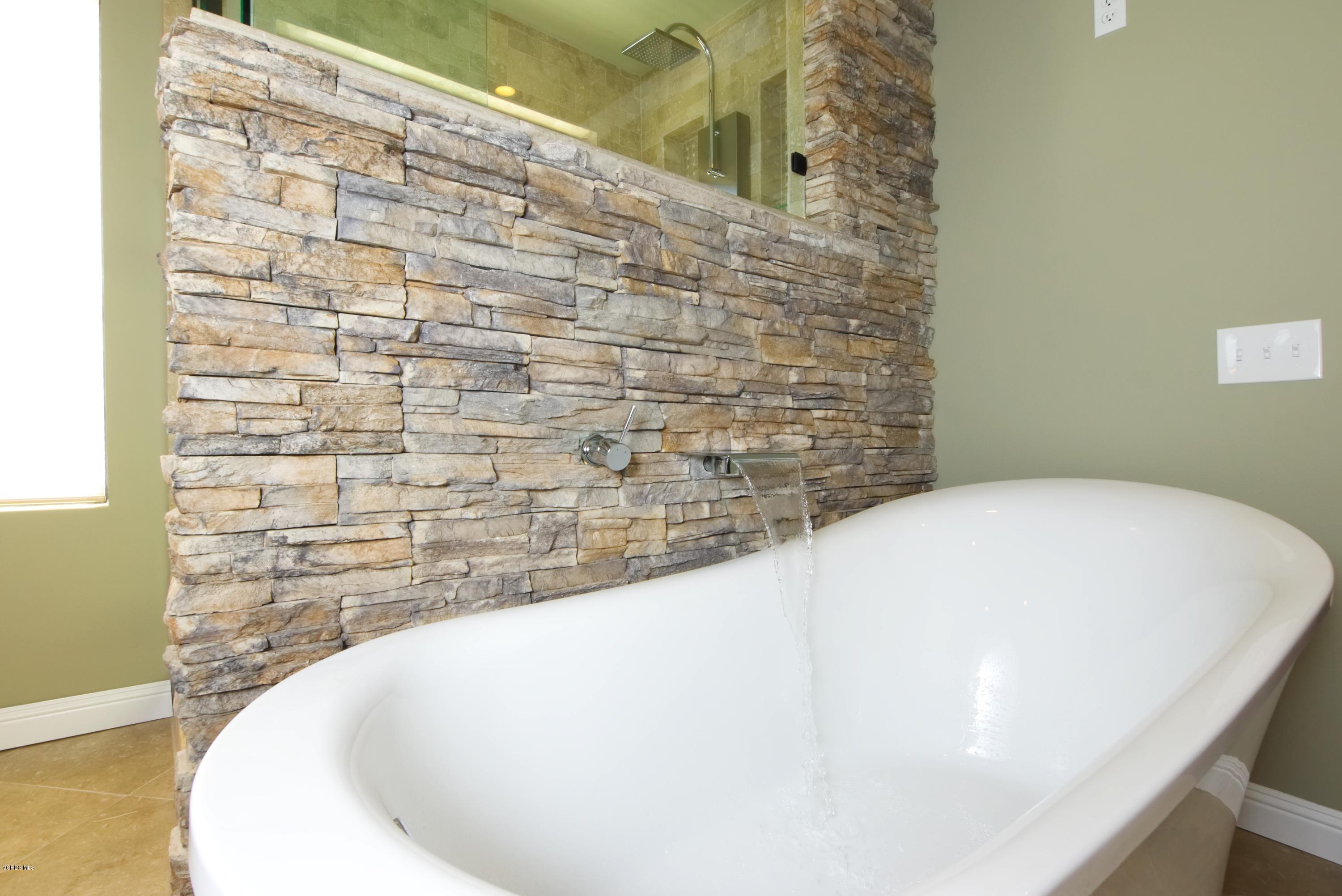1133 Old Ranch Road Camarillo, CA 93012 - Photo 24 of 37 a close up of a bathtub in a bathroom