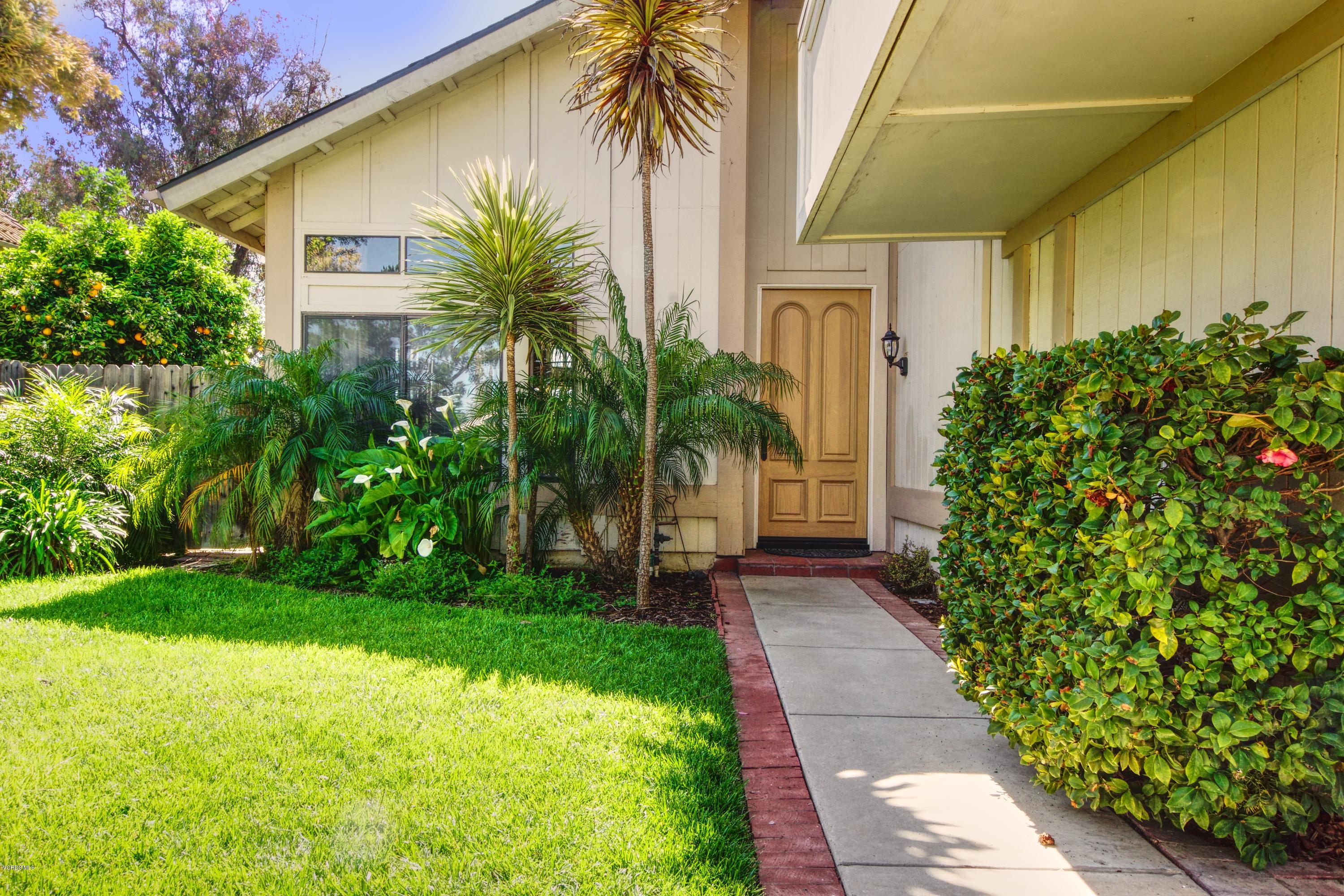 1133 Old Ranch Road Camarillo, CA 93012 - Photo 4 of 37 a couple of palm trees in front of yellow house