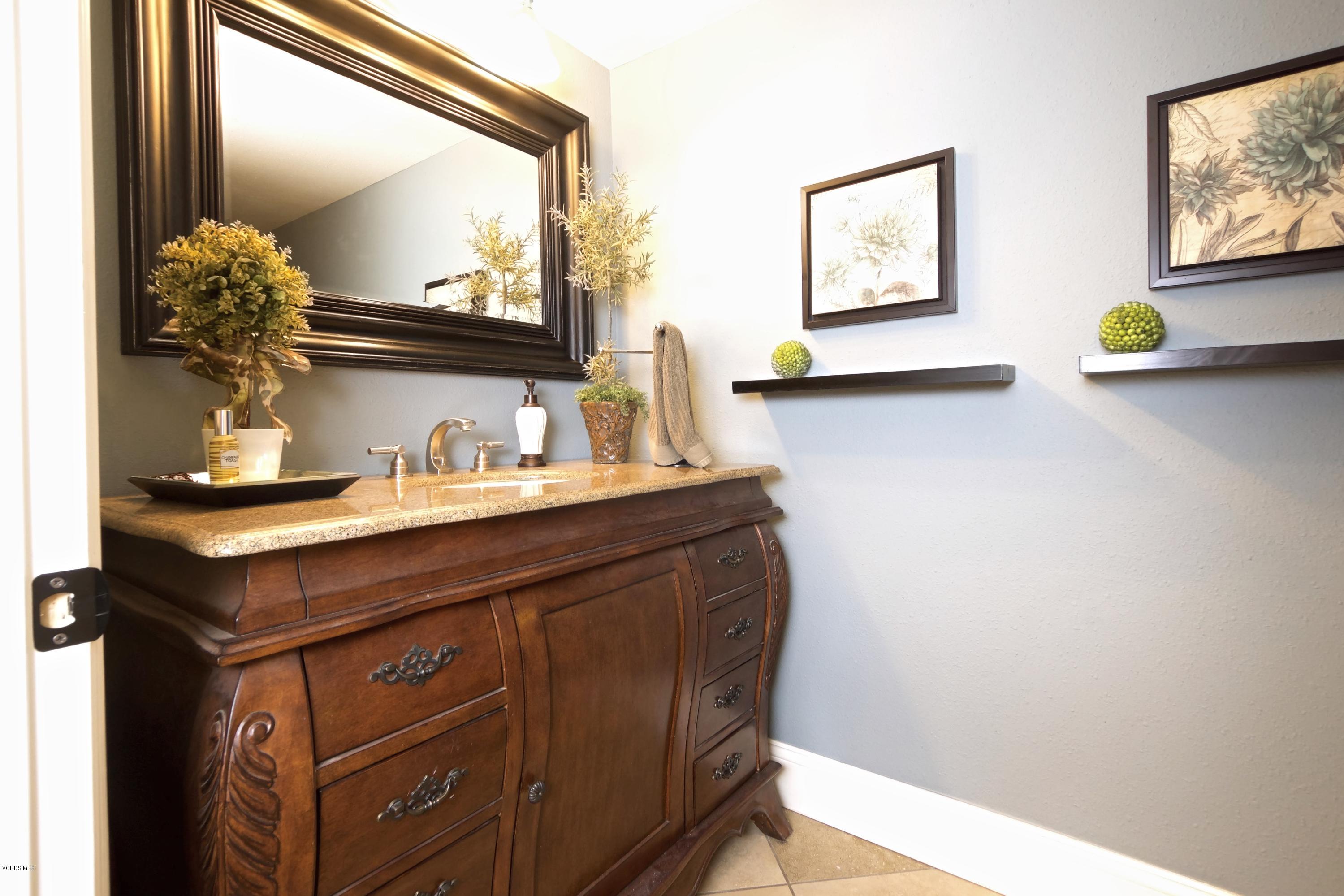 1133 Old Ranch Road Camarillo, CA 93012 - Photo 31 of 37 a bathroom with a sink mirror and vanity