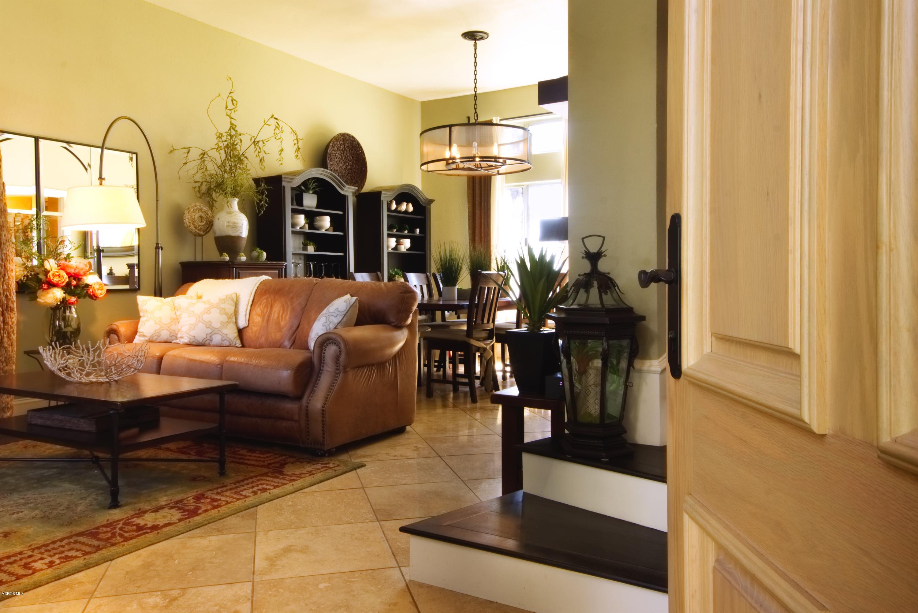 1133 Old Ranch Road Camarillo, CA 93012 - Photo 5 of 37 a living room with furniture a dining table and a chandelier