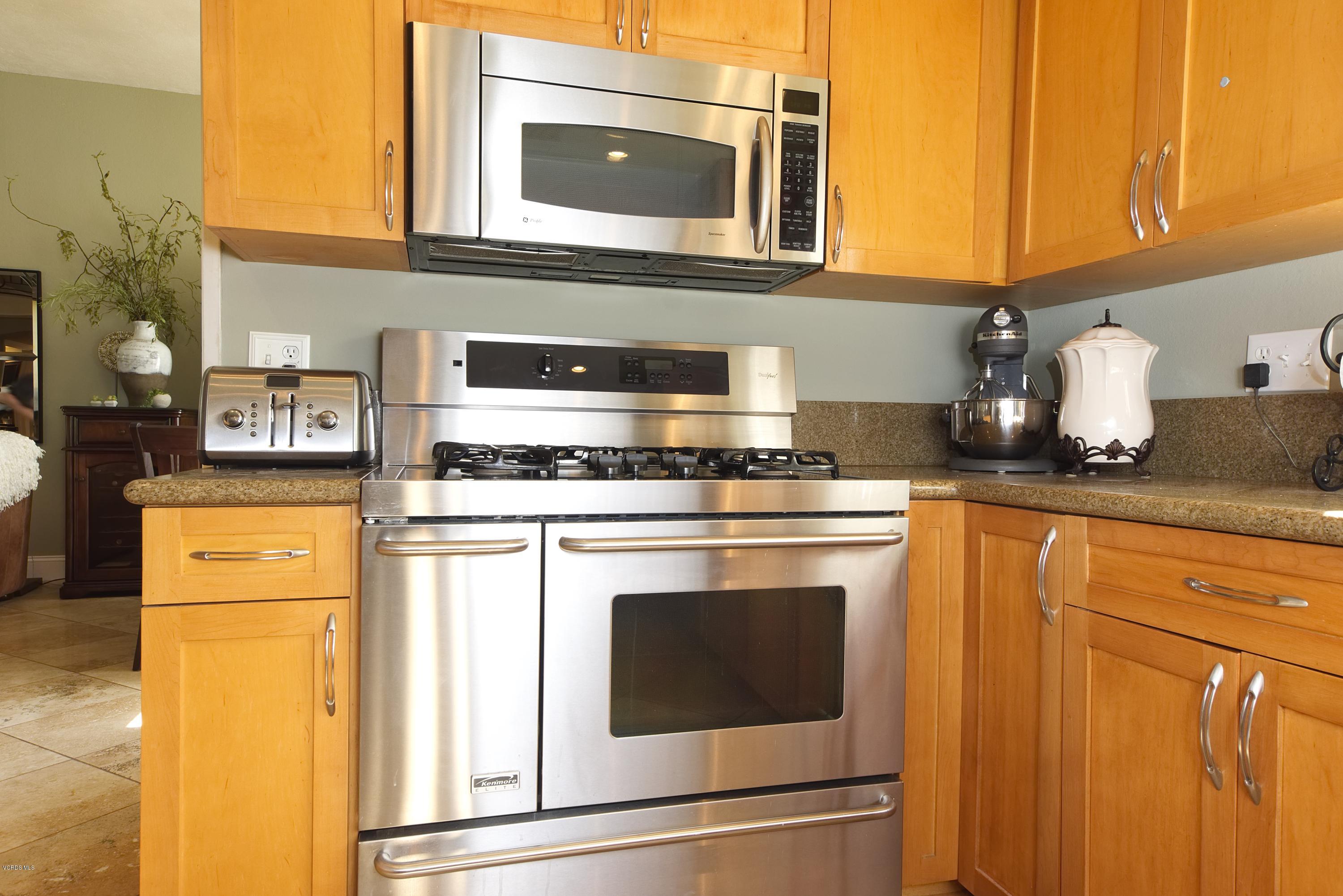1133 Old Ranch Road Camarillo, CA 93012 - Photo 8 of 37 a kitchen with granite countertop cabinets stainless steel appliances and a counter space