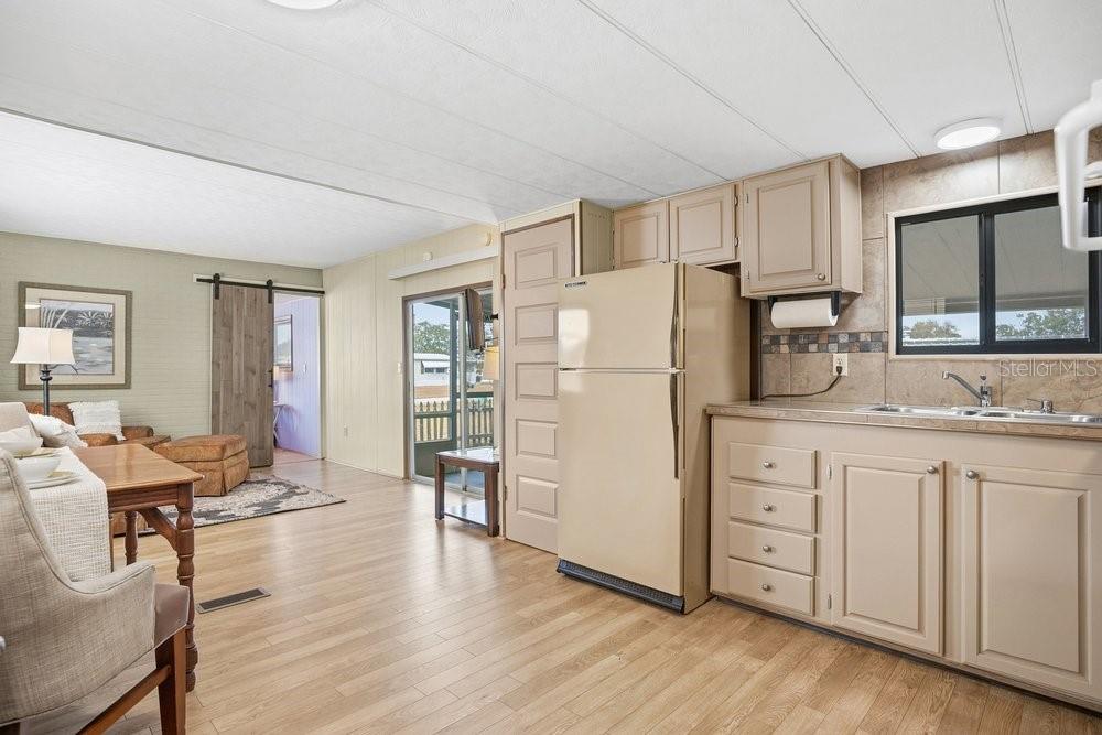 6 Florence Boulevard DeBary, FL 32713 - Photo 12 of 44 a kitchen with stainless steel appliances granite countertop a refrigerator stove microwave and white cabinets