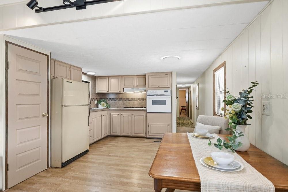 6 Florence Boulevard DeBary, FL 32713 - Photo 13 of 44 a kitchen with white cabinets and refrigerator