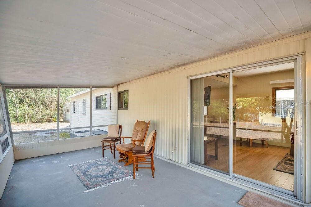 6 Florence Boulevard DeBary, FL 32713 - Photo 25 of 44 a living room with furniture and a floor to ceiling window