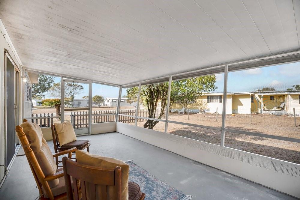 6 Florence Boulevard DeBary, FL 32713 - Photo 27 of 44 a view of a porch with furniture and floor to ceiling window