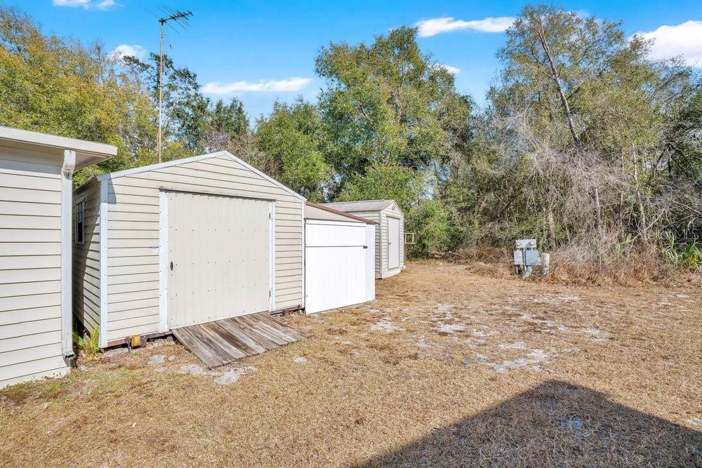 6 Florence Boulevard DeBary, FL 32713 - Photo 31 of 44 a front view of a house with a yard and garage