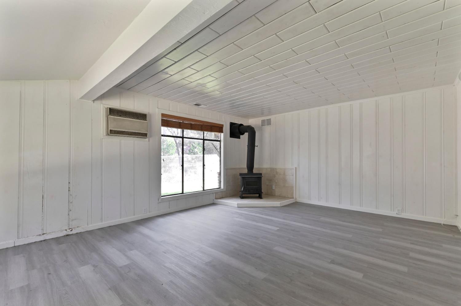 17542 Climax Road Jackson, CA 95642 - Photo 63 of 86 a view of an empty room with wooden floor and a window
