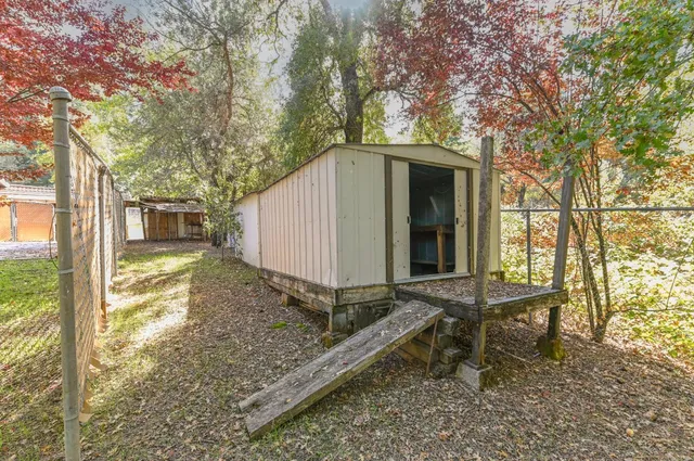 a view of a yard with an outdoor space
