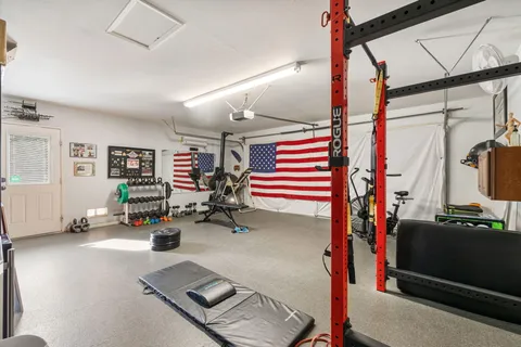 a view of a swimming pool with chairs in patio
