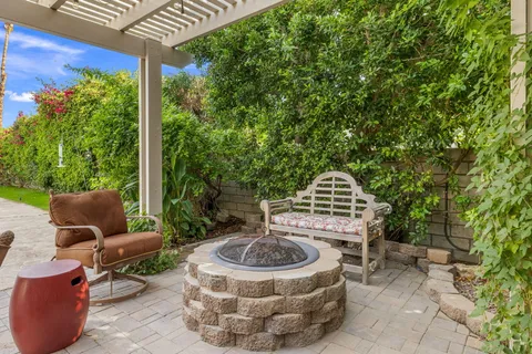 a front view of house with outdoor space and swimming pool