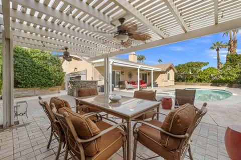 a view of a swimming pool with a yard