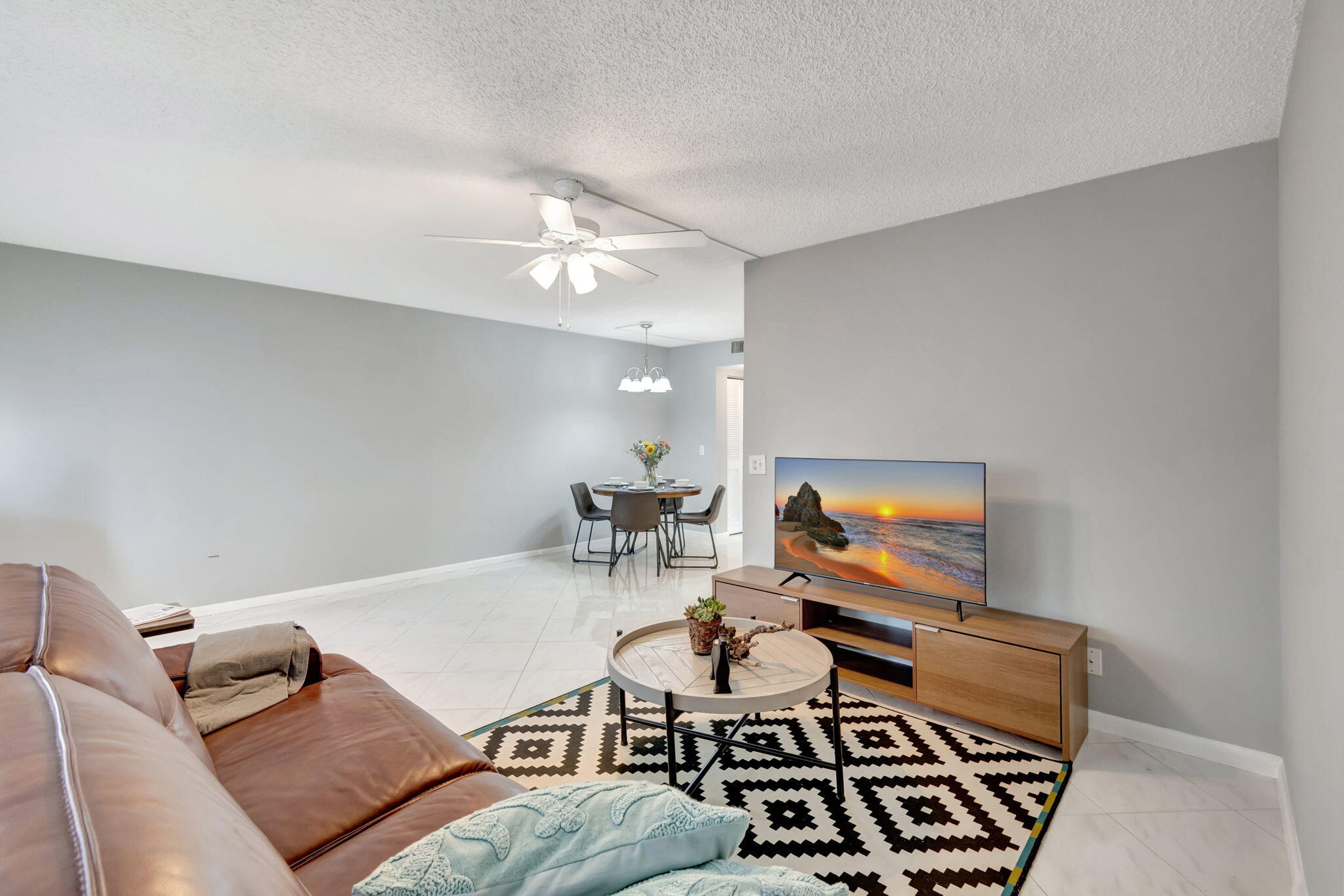 3031 Cornwall East Boca Raton, FL 33434 - Photo 5 of 84 a living room with furniture and a flat screen tv