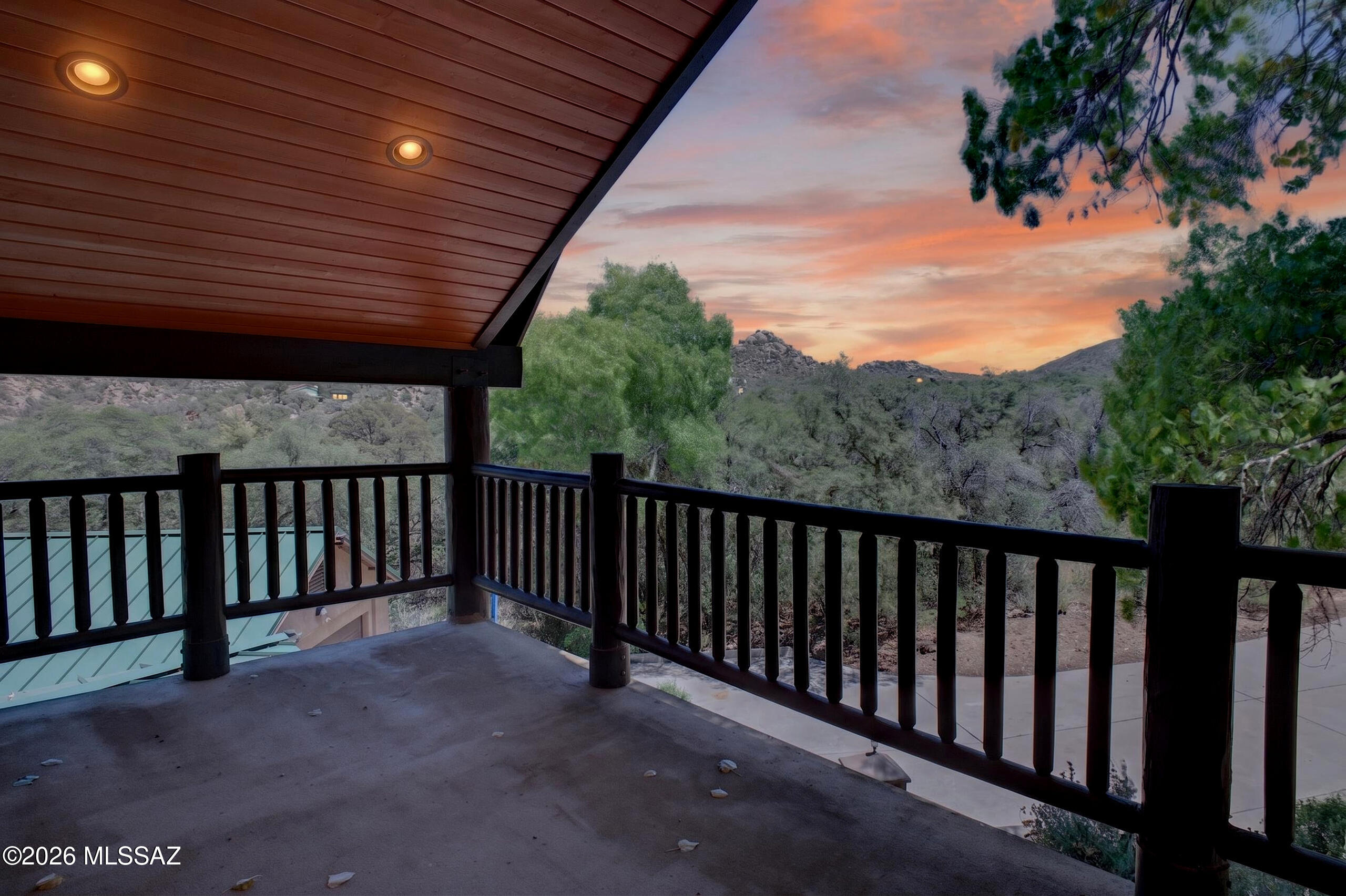 531 South Cody Loop Road Oracle, AZ 85623 - Photo 4 of 38 a balcony with wooden floor and fence