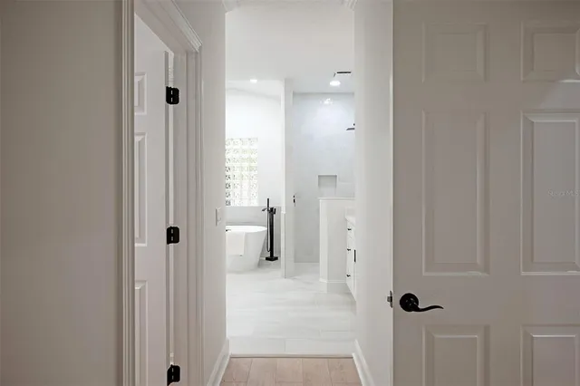 a bathroom with a shower sink and mirror
