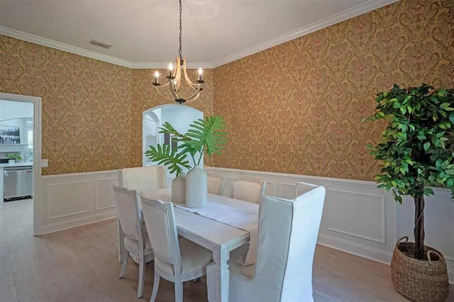 a kitchen with cabinets appliances a sink and a counter top space