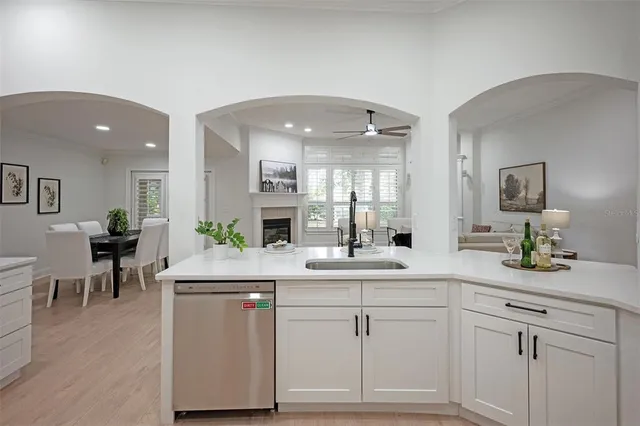 a kitchen with a sink and cabinets