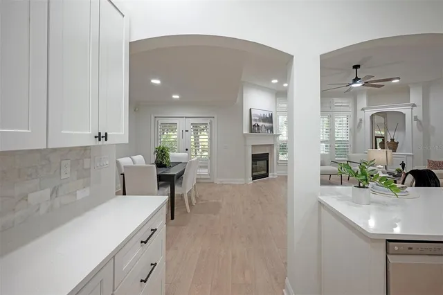 a view of a livingroom with furniture window and a fireplace