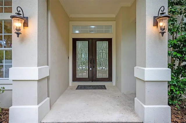 a living room with furniture and a painting on the wall