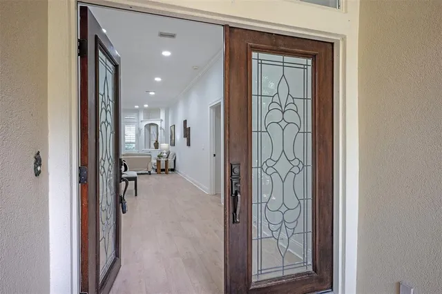 a view of a bathroom from a hallway