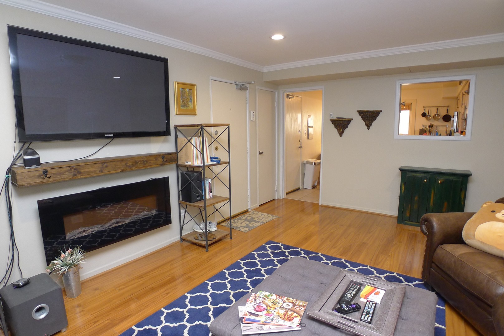 547 Sheridan Road, Unit 1E Evanston, IL 60202 - Photo 2 of 16 a living room with furniture a flat screen tv and a fireplace