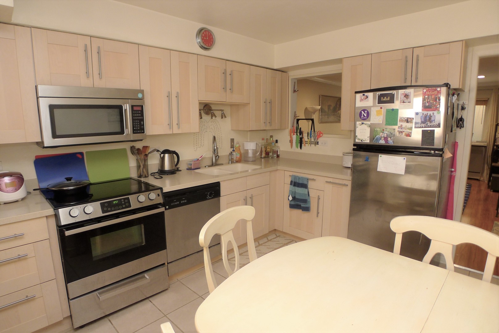 547 Sheridan Road, Unit 1E Evanston, IL 60202 - Photo 5 of 16 a kitchen with stainless steel appliances a stove a sink a microwave a refrigerator and cabinets