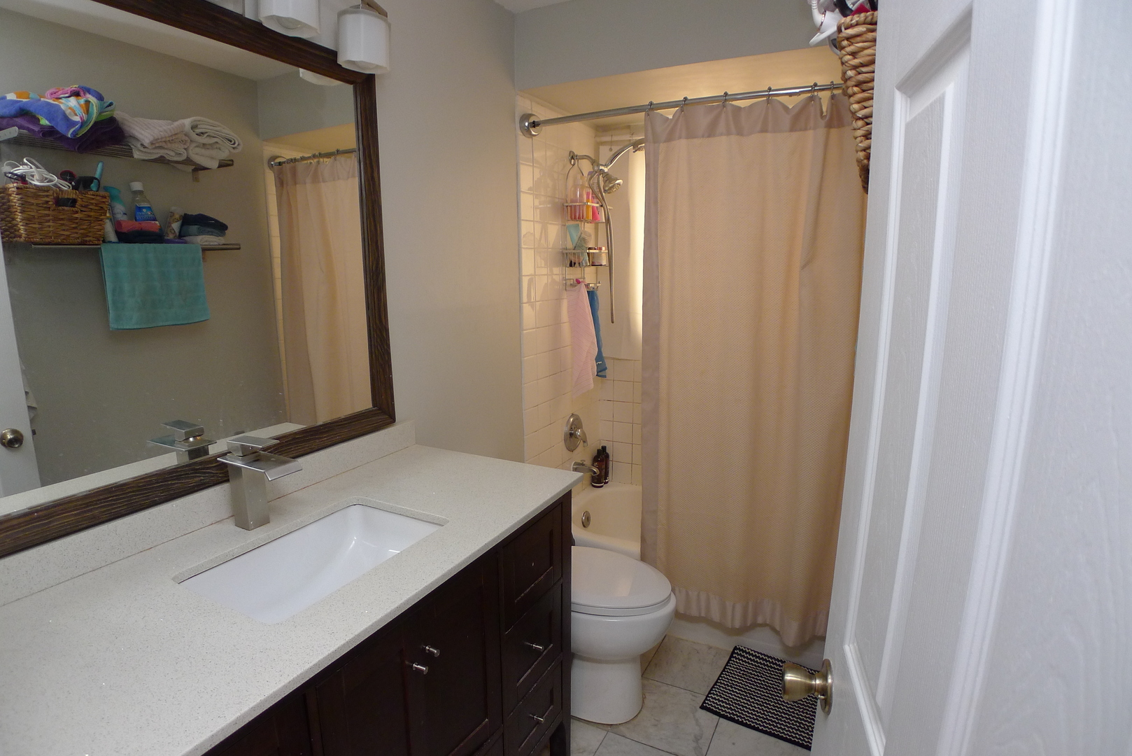 547 Sheridan Road, Unit 1E Evanston, IL 60202 - Photo 7 of 16 a bathroom with a sink a toilet and shower