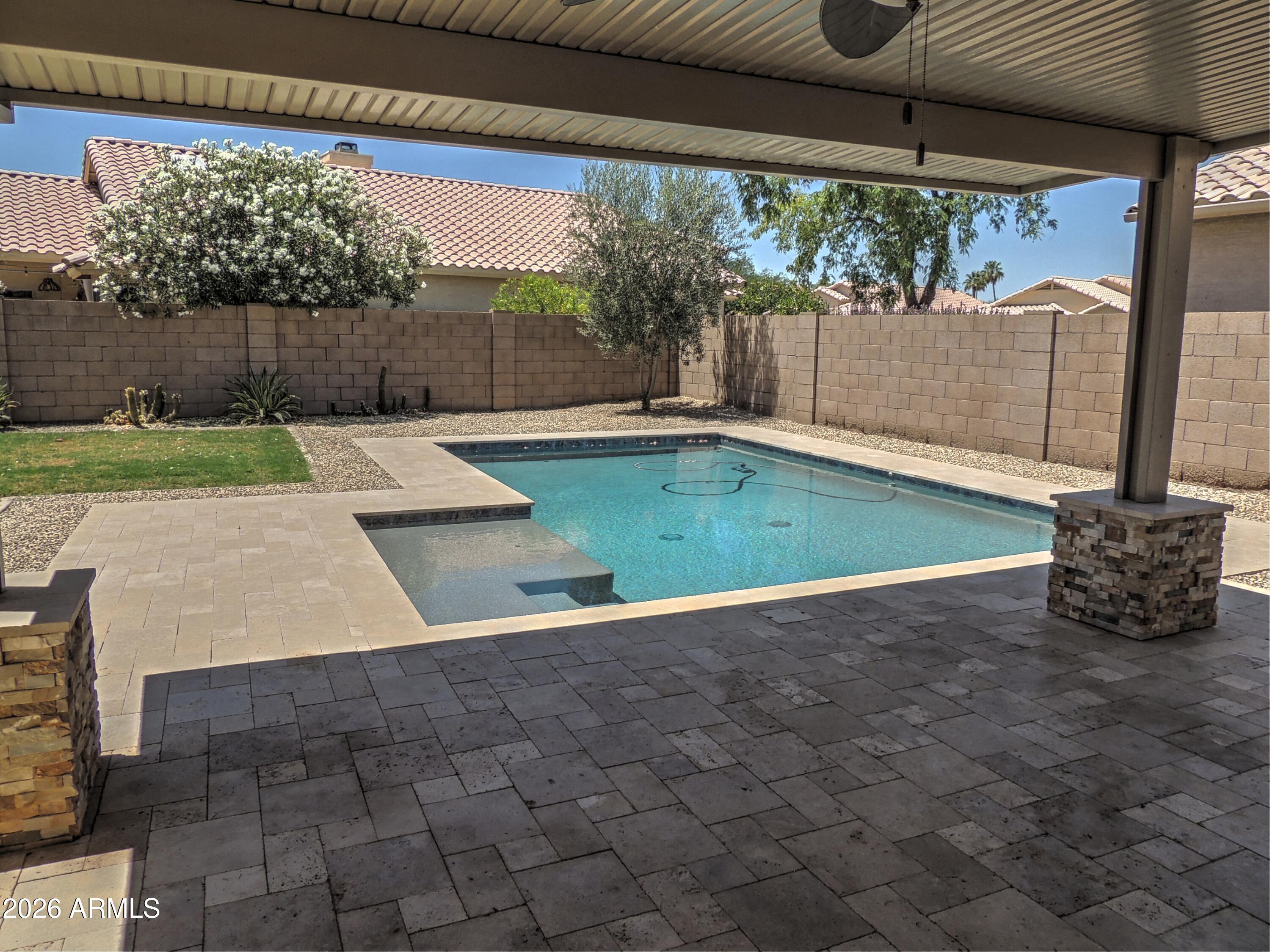 4409 East Dry Creek Road Phoenix, AZ 85044 - Photo 28 of 34 a view of a backyard with a small cabin