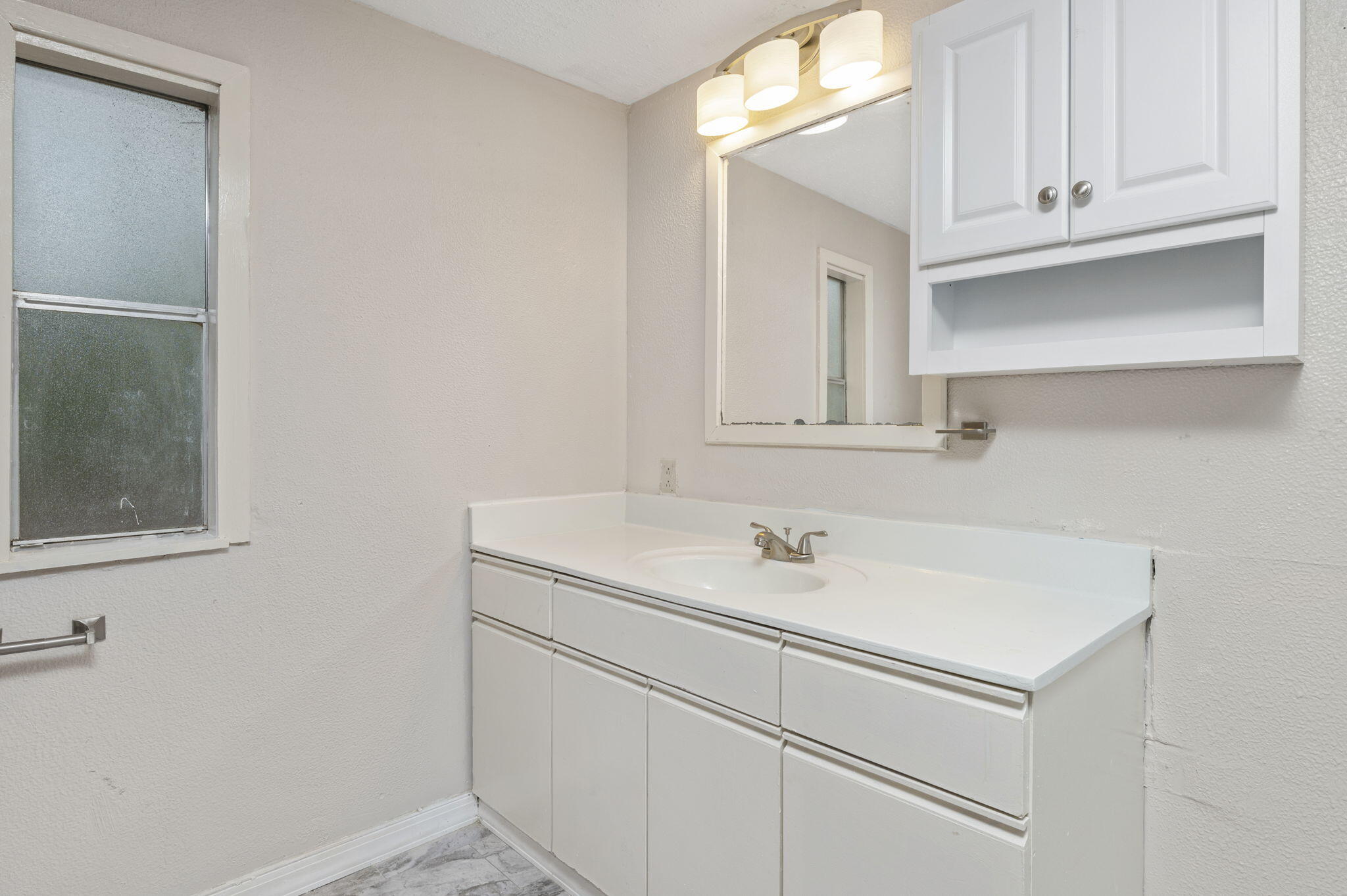 1108 Country Living Road Baker, FL 32531 - Photo 19 of 33 a bathroom with a sink and a mirror