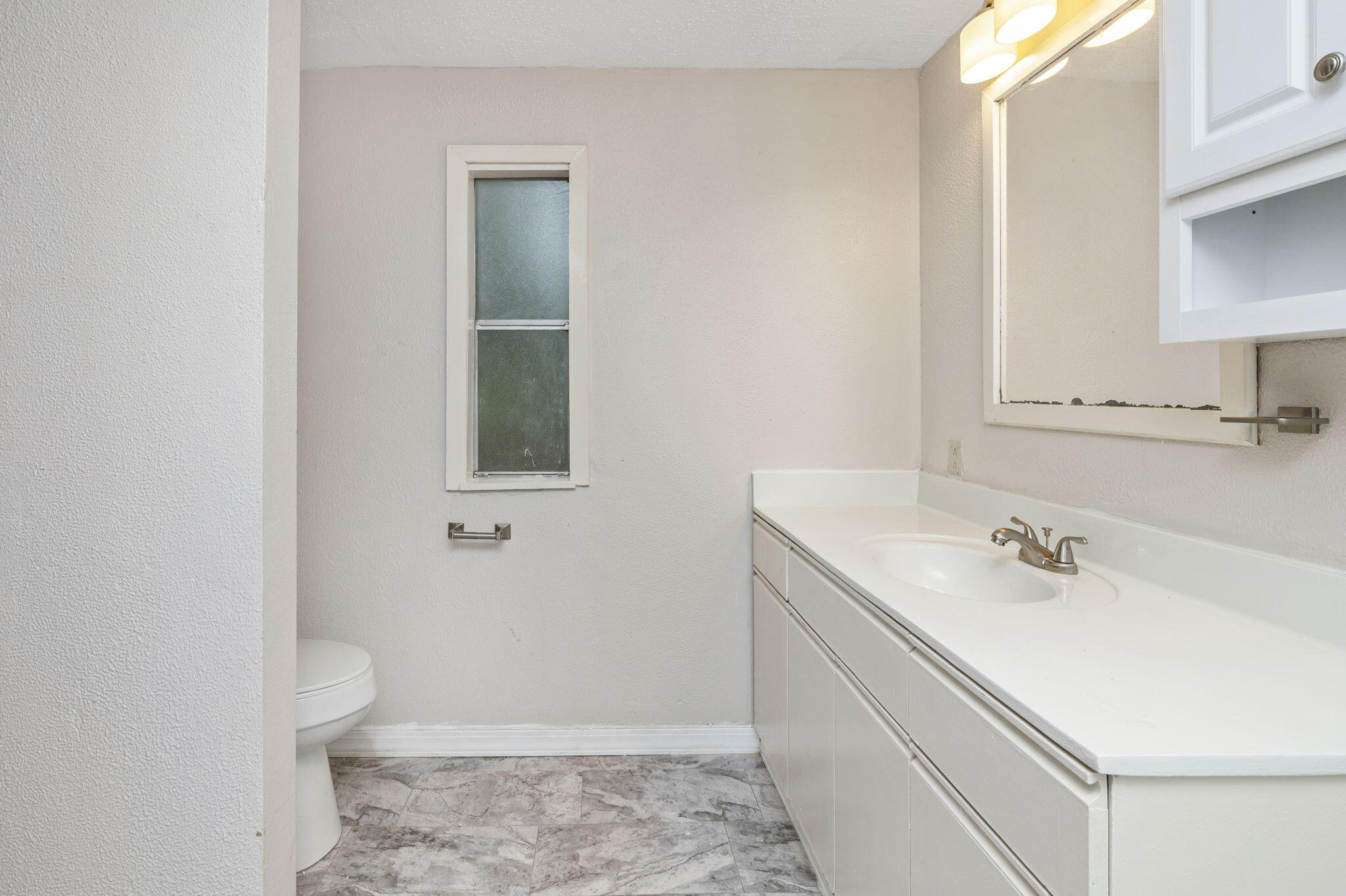 1108 Country Living Road Baker, FL 32531 - Photo 20 of 33 a bathroom with a sink toilet and vanity