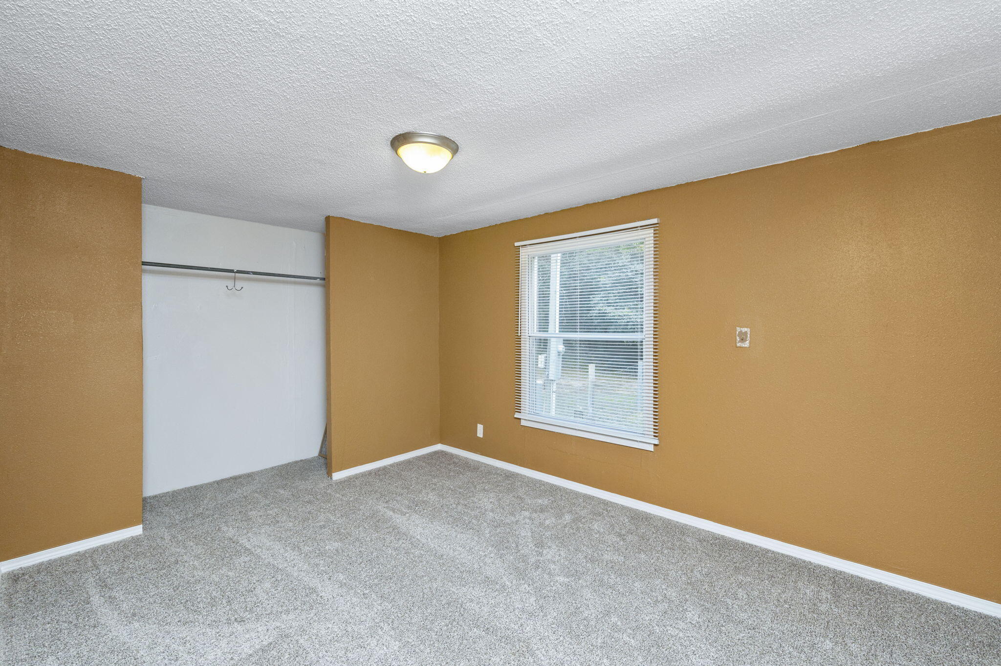 1108 Country Living Road Baker, FL 32531 - Photo 23 of 33 an empty room with windows
