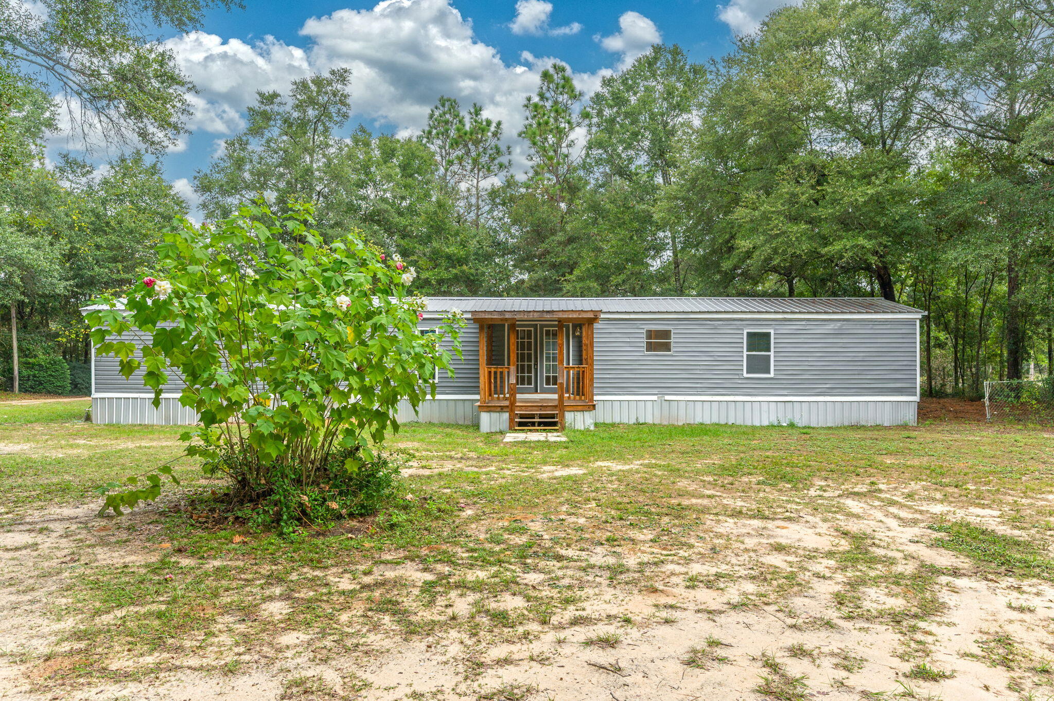 1108 Country Living Road Baker, FL 32531 - Photo 29 of 33 a view of a house with a yard