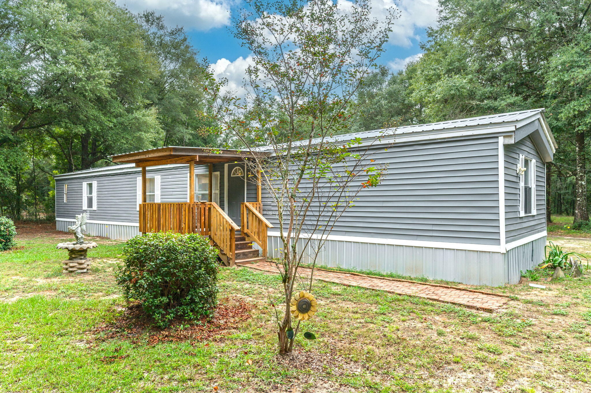 1108 Country Living Road Baker, FL 32531 - Photo 3 of 33 a house view with a backyard space