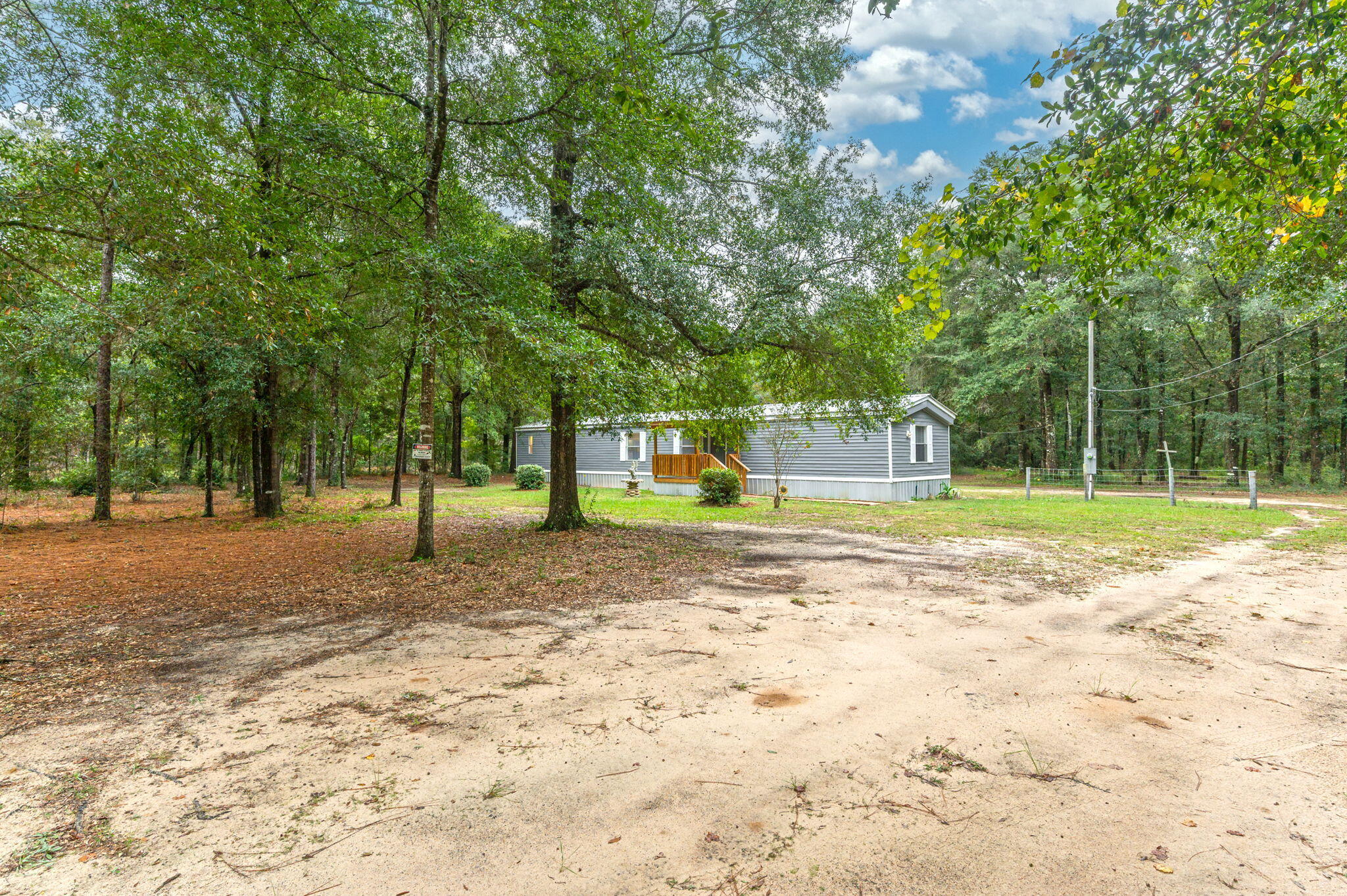 1108 Country Living Road Baker, FL 32531 - Photo 5 of 33 a view of a yard with swings