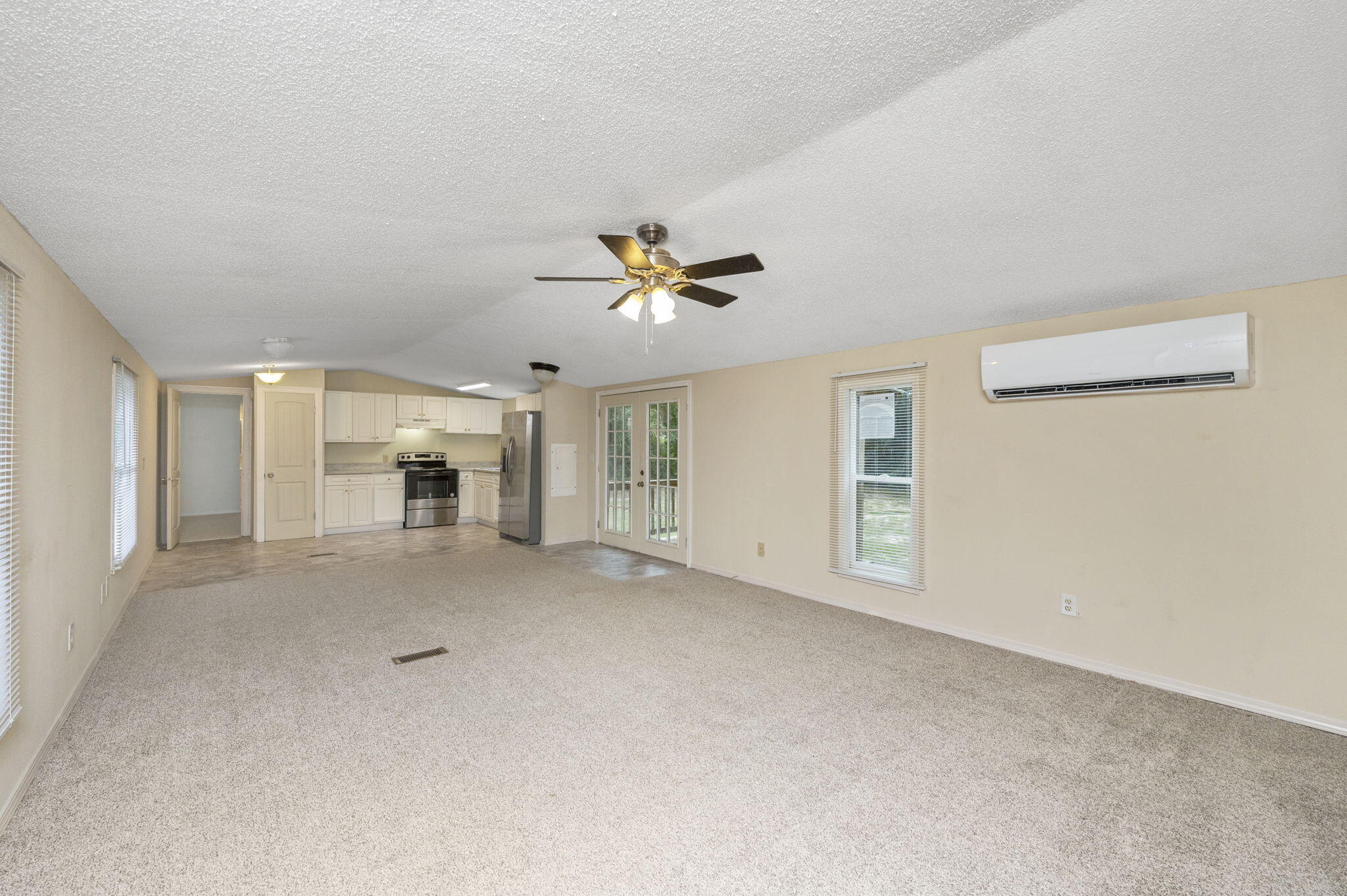 1108 Country Living Road Baker, FL 32531 - Photo 7 of 33 a view of a livingroom with a ceiling fan and window