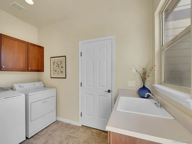 a bathroom with a tub sink and vanity