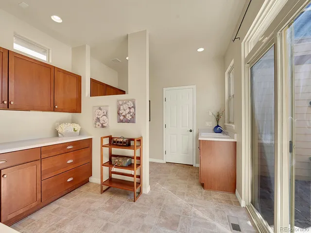 a room with furniture a mirror and a dresser