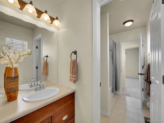 a bathroom with 2 sink and a mirror