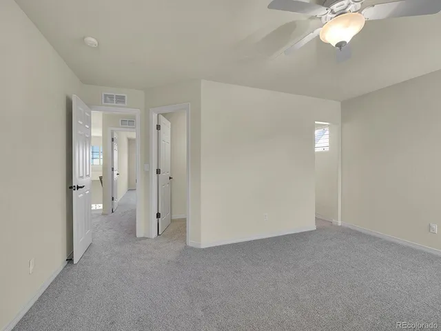 a view of a livingroom with a chandelier fan