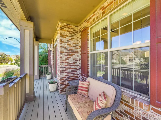 a view of a balcony with chairs