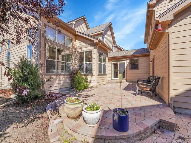 a view of a patio with chair and table