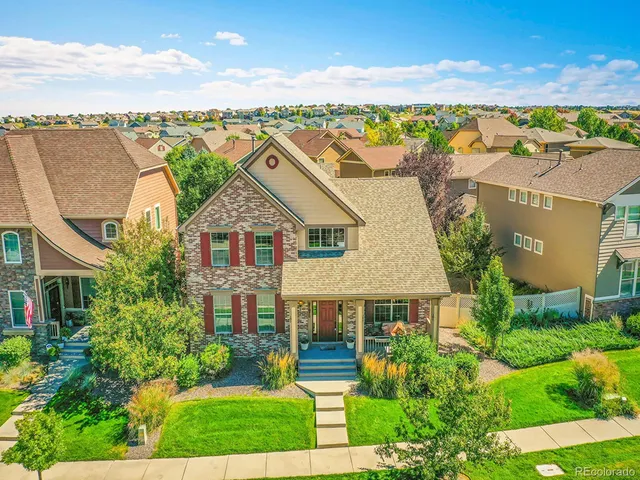 an aerial view of houses with yard