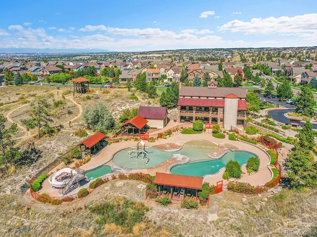 an aerial view of a swimming pool and mountain view