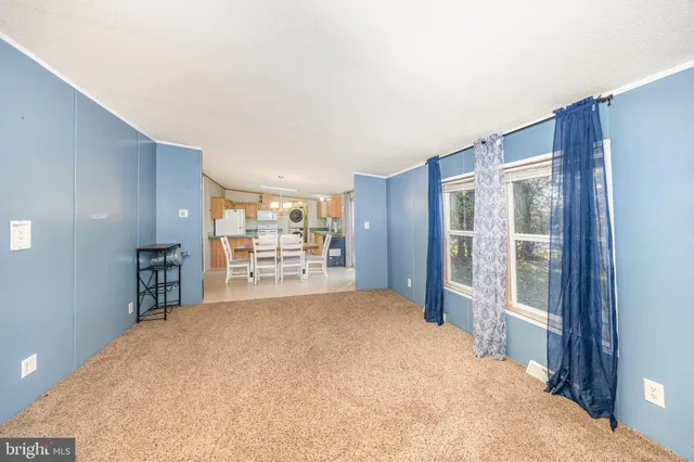 a large bedroom with a large bed and a large window