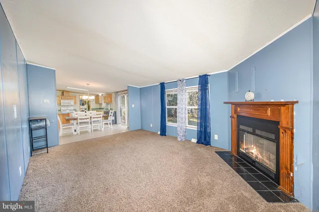 a large bedroom with a bed and a television in it